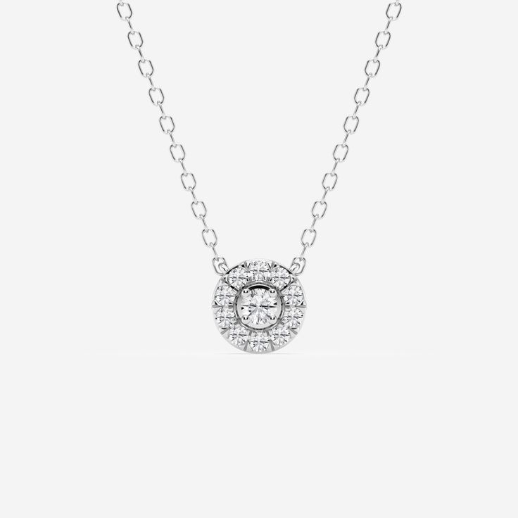 Pay homage to the flower power movement of the 60s with this beautiful floral-inspired round diamond pendant. A central round diamond is encased in a pave outer circle, creating a stunning petal effect. Ideal for layering or wearing on its own, this gorgeous floral-inspired diamond pendant radiates with elegance and femininity. Halo Necklace, Halo Pendant, Round Moissanite, Engagement Ring Wedding Band, Diamond Halo, Exquisite Jewelry, Moissanite Diamonds, Perfect Ring, Halo Diamond