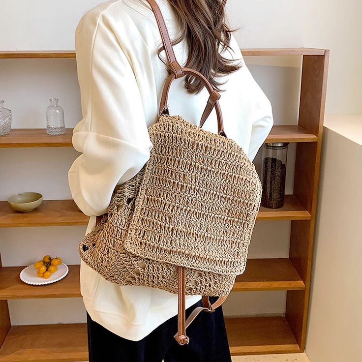 In Stock Fast Shipping from Los Angeles! The Elena Handbags Straw Backpack with Leather Strap is a perfect combination of style and sophistication. The straw body is both delicate and durable, while the leather strap lend a touch of luxury to this classic design. Perfect for the modern fashionista, this backpack is ideal for a luxurious take on everyday style. Size: 34cm wide x 40cm tall (13in x 16in) Designer Style ID: 8463 Elena Handbags Straw Tote with Leather Strap and Tassle Straw Backpack, Straw Tote, Designer Style, Everyday Style, Inside Pocket, Everyday Fashion, The Modern, Classic Design, Leather Straps