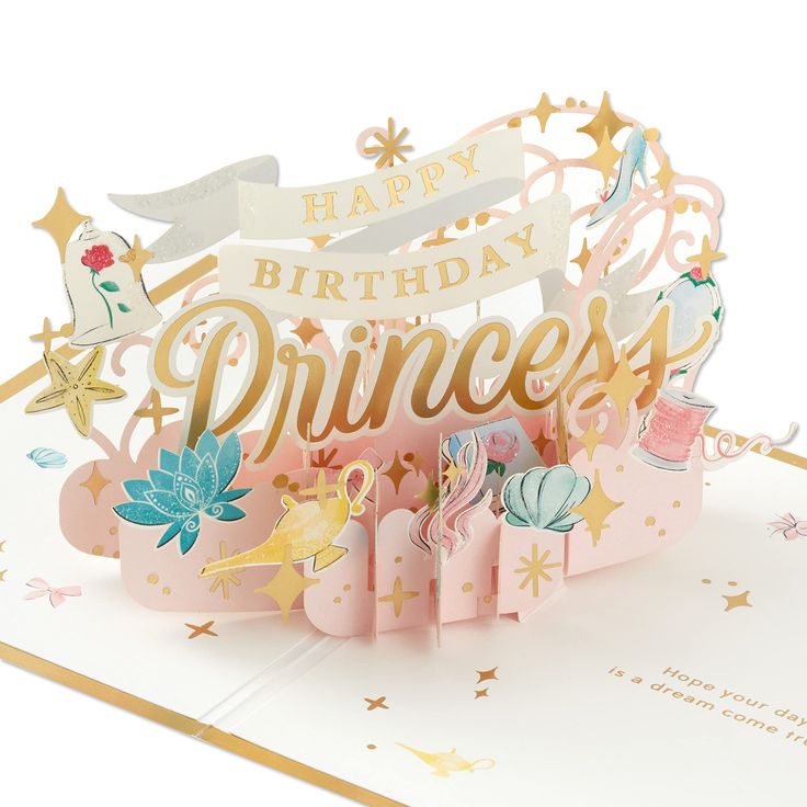 a pink princess birthday card with gold foil lettering and stars on the top, sitting in front of a white background