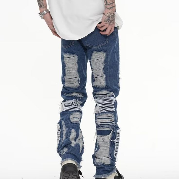 Introducing our trendy hip hop ripped mesh jeans! Made for the fashion-forward individual, these jeans feature strategically placed rips and mesh details, perfect for adding an edgy touch to any outfit. Express your unique style and stand out from the crowd with these one-of-a-kind jeans. Features: -95% Cotton -Mid-Waist -Pleated Design -Premium Denim Fabric -Ripped -Patchwork -Regular fit -Hip Hop style Grunge Streetwear Bottoms With Holes, Grunge Bottoms With Holes For Streetwear, Edgy Jeans With Holes For Streetwear, Streetwear Straight Leg Jeans With Holes, Streetwear Cotton Bottoms With Holes, Straight Leg Jeans With Holes For Streetwear, Casual Jeans With Holes For Streetwear, Ripped Jeans For Streetwear, Holes Denim Jeans For Streetwear