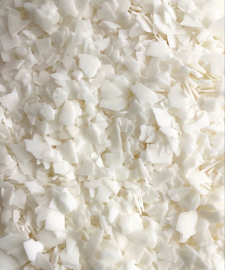 a pile of shredded white paper sitting on top of a table