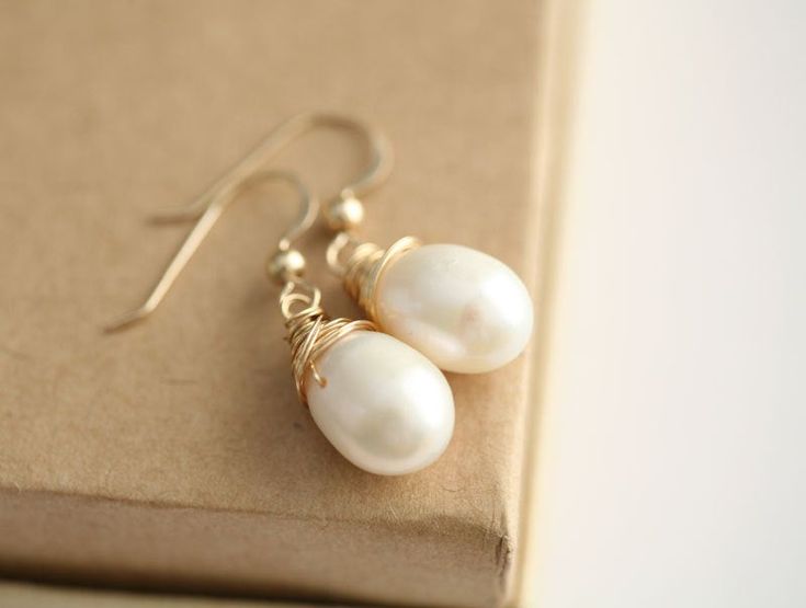 Wire wrapped pearl earringseveryday jewelrybridesmaid | Etsy Gold Wire Wrapped 14k Gold Filled Pearl Earrings, Gift Teardrop 14k Gold Filled Pearl Earrings, Gold Wire Wrapped Pearl Earrings For Gift, Gold Wire Wrapped 14k Gold-filled Pearl Earrings, Gold Wire Wrapped Pearl Earrings In 14k Gold, Gold Wire Wrapped Teardrop Earrings For Gift, Wire Wrapped Yellow Gold Pearl Earrings Gift, Dainty Wire-wrapped Pearl Earrings For Gift, Yellow Gold Wire Wrapped Pearl Earrings Gift