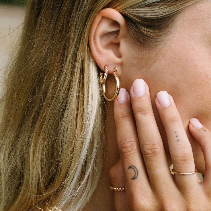 At 25mm, these hoops are our most statement earrings to date. The Honey Hoops are a timeless statement piece and can be worn as a daily sample. They are also so fun to pair with another one of our gold earring pairs.    - 25mm 14k Gold-Filled hoops - 3mm thickness - Waterproof, Non-Tarnish, Hypoallergenic - Handcrafted Hypoallergenic Small Hoop Earrings In 14k Gold Filled, Trendy Small Hoop 14k Gold Jewelry, Trendy 14k Gold Small Hoop Jewelry, Everyday Small Hoop Earrings Tarnish Resistant, Chic Rose Gold Hoop Earrings For Everyday, Chic Everyday Rose Gold Hoop Earrings, 14k Gold Filled Huggie Single Hoop Earring, Trendy Tarnish Resistant 14k Gold Filled Hoop Earrings, Trendy Nickel-free Yellow Gold Hoop Earrings