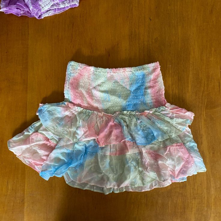 Brand New Come Together Pastel Tie Dye Skirt From Isabelle’s Cabinet. Brand New Never Worn Just Didn’t Come With Tags! Would’ve Returned But Missed The Return Window! Size Medium Pink Party Skirt With Elastic Waistband, Multicolor Tiered Skort With Lined Skirt, Fitted Multicolor Ruffled Mini Skirt, Summer Multicolor Ruffled Mini Skirt, Vacation Pink Skirted Skort, Pink Skirted Skort For Vacation, Multicolor Tiered Skort For Summer, Beach Skort With Ruffled Skirt In Pink, Pink Ruffled Skort For Beach