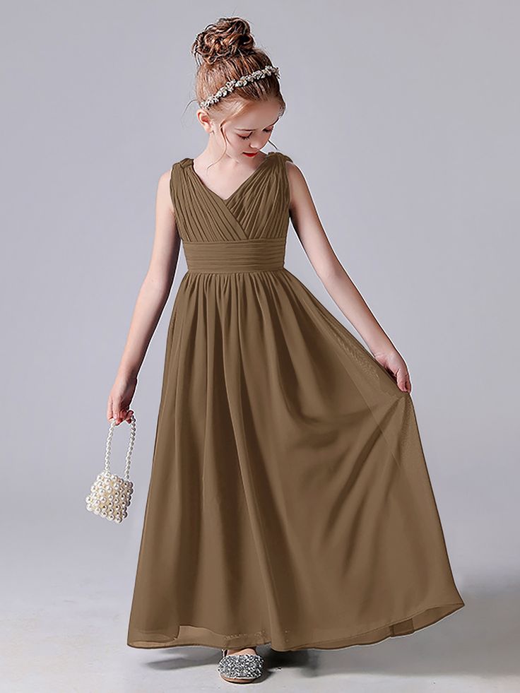 Description:   V Neck Pleats Sleeveless Bridesmaid Dress   Details:     Silhouette: A-line  Fabric: Chiffon  Neckline: V Neck   Sleeve Length: Sleeveless  Embellishment: Pleats  Floor-length chiffon dress.   With padding and boning.    Available in full-size range (J4-J16) and in  custom size         Ask a question Brown Sleeveless Dress With Ruched Bodice, Sleeveless Bridesmaid Dress With Ruched Bodice, Sleeveless Bridesmaid Dresses, Peacock Green, Dress Purchase, A Question, Dresses For Teens, Pink Candy, Different Fabrics