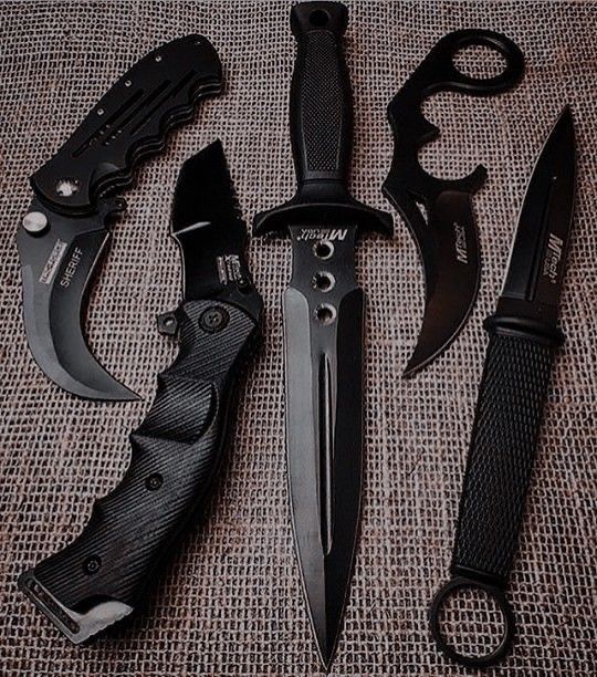 three different types of knifes and knives on a tablecloth with burlock