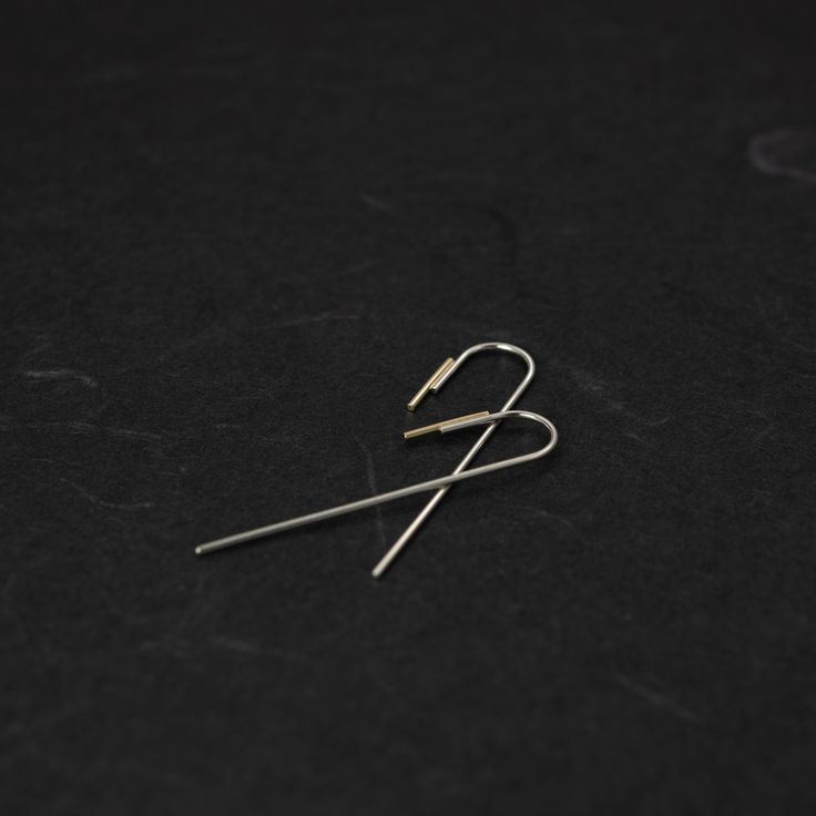 "This pair of minimalistic Arch threader earrings is shaped from a 0,9mm sterling silver wire and then soldered to a 1mm 18kt solid gold wire of 1cm and then brushed for a matte finish. Also available in a traditional shiny finish. They are perfect to complete any casual outfit, also the best gift for design lovers. This listing is for one pair of earrings. ------ HIGH QUALITY We create long lasting, timeless design jewelry handcrafted in Paris with loving attention to details. All AgJc jewelry Minimalist Hammered Sterling Silver Linear Earrings, Minimalist White Gold Earrings With Ear Wire, Minimalist Sterling Silver Ear Climbers With Ear Wire, Minimalist White Gold Linear Earrings With Ear Wire, Minimalist White Gold Long Drop Earrings, Minimalist Linear Earrings With French Hook, Minimalist Yellow Gold Linear Earrings In Sterling Silver, Minimalist Hoop Earrings With French Hook, Minimalist Long Drop Earrings With French Hook