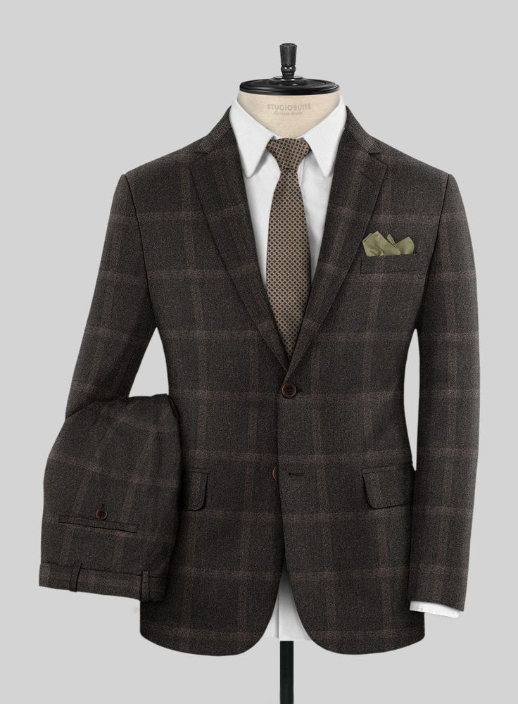 Presenting our esteemed Loro Piana Vittoria Wool Suit—an embodiment of timeless elegance paying homage to classic aesthetics while exuding a distinctive charm. Crafted from superfine merino wool, this exceptional ensemble features an artful fusion of plaid patterns expertly woven against a rich brown backdrop, imparting an undeniable air of confidence. For those in pursuit of a standout sartorial statement, this suit is the epitome of refined conversation.   Choice of the Elite, Loro Piana is ow Classic Three-piece Suit For Business Casual In Winter, Classic Winter Three-piece Suit For Business Casual, Classic Business Casual Three-piece Suit For Winter, Luxury Three-piece Suit For Business In Winter, Classic Winter Suit With Custom Fit, Luxury Wool Tweed Jacket For Formal Occasions, Timeless Wool Three-piece Suit For Business Casual, Classic Winter Workwear Set, Timeless Fitted Winter Suit