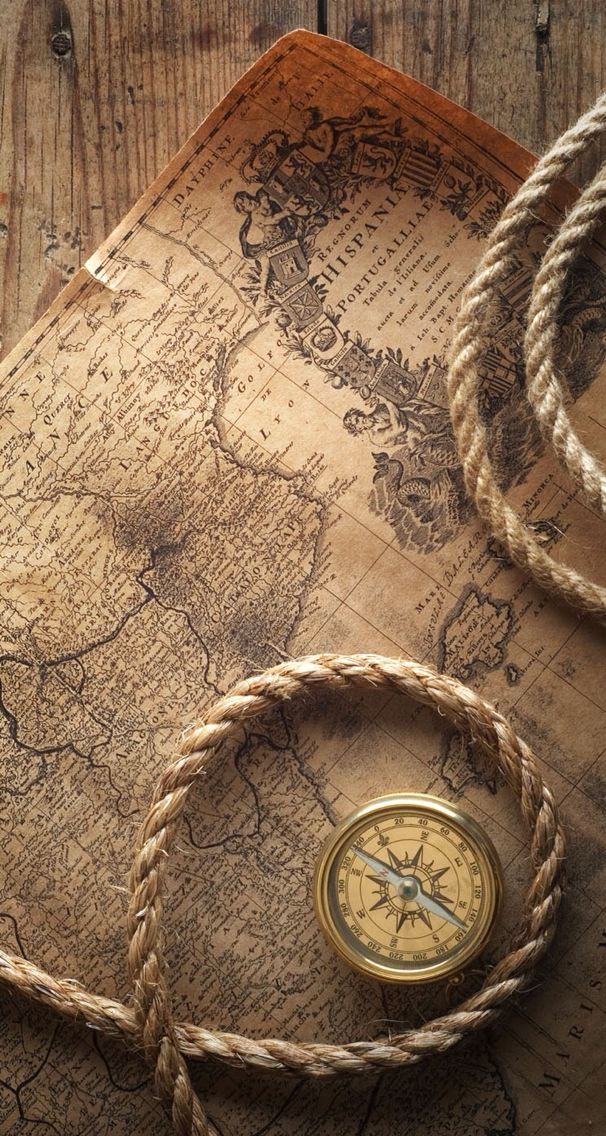 an old map with rope and compass on it