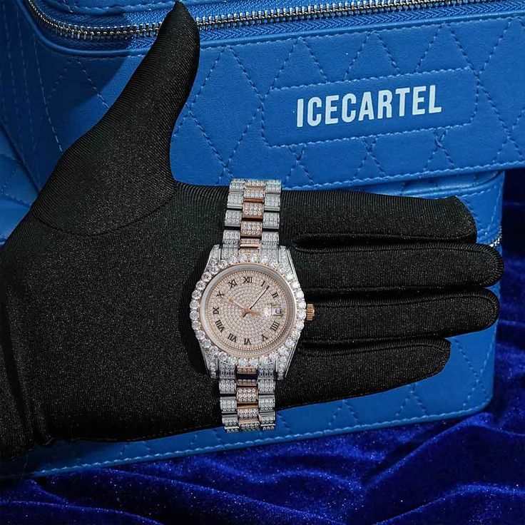 ICECARTEL exclusive Moissanite Presidential Watch is now available, made of stainless steel and PVD plated with a thick layer of 14K Rose Gold. This moissanite watch is iced out with round D-color VVS moissanite diamonds. All of the diamonds on this presidential watch are guaranteed to pass the diamond tester. The dial of the watch is black. This moissanite watch features a self-winding mechanism that gets Its energy from natural motion of the wearer (mainspring).Every watch comes in an universa Moissanite Watch, Diamond Tester, Timeless Luxury, Luxury Timepieces, Moissanite Jewelry, Roman Numeral, Two Tone Watch, Wristwatch Men, Roman Numerals