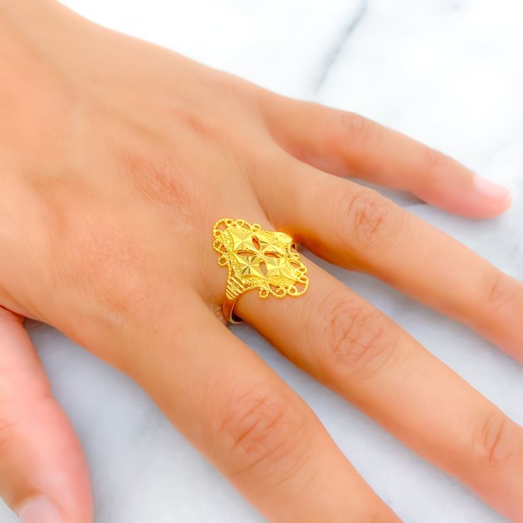 This intricate and trendy ring, crafted from 22k gold and weighing 3.7 grams, features a stunning yellow gold finish. With a ring size of 8.5, this piece combines contemporary design with timeless elegance. The availability of ring sizing ensures a perfect fit for every individual. Ideal for those seeking a fashionable yet sophisticated addition to their jewelry collection, this ring stands out with its detailed craftsmanship and luxurious appeal, adding a touch of modern sophistication to any look. Product Details Gold Purity(karat): 22k Gold Weight(grams): 3.7 Item Finish: Yellow Gold Ring Size: ﻿8.5﻿ Ring Sizing Available: Yes // 22k Gold Fine Jewelry Rings For Gift, Fine Jewelry 22k Gold Rings For Gift, 22k Gold Diamond Ring For Anniversary, Yellow Gold Open Filigree Ring For Formal Occasions, Yellow Gold Open Filigree Ring For Formal Events, Elegant 22k Gold Engraved Ring, Fine Jewelry 22k Gold Ring For Formal Occasions, Gold Signet Ring With Intricate Design For Formal Occasions, 22k Gold Diamond Wedding Ring