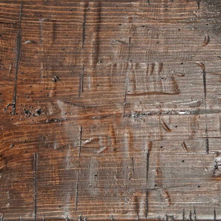 an old wooden table with peeling paint on the top and wood grains all over it