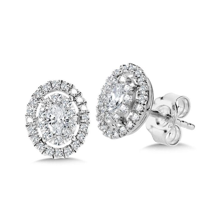 Birmingham Jewelry Item Number: EDB050-W EDB075-WType: Earrings Style: Studs14K White Gold Earrings These oval-shaped Diamond Star Mirage cluster diamond studs are just as impressive up close as they are far away - from a distance, this cluster of precious gems unite, bursting into a brilliant illusion of one grand gem. The diamond halo then highlights this illusion even more.Total Diamond Weight: 0.50ct approx.Total Diamond Weight: 0.75ct approx. *The possibilities are not limited to the option Luxury Classic Cluster Earrings With Halo Design, Luxury Dazzling Cluster Earrings With Halo Setting, Luxury Pave Setting Cluster Earrings, Diamond Halo Earrings For Anniversary, Diamond Halo Bridal Earrings In Fine Jewelry Style, Fine Jewelry Cluster Earrings With Halo Design For Anniversary, Diamond Halo Bridal Earrings Fine Jewelry, Diamond Bridal Earrings With Halo Design, Fine Jewelry Diamond Halo Earrings