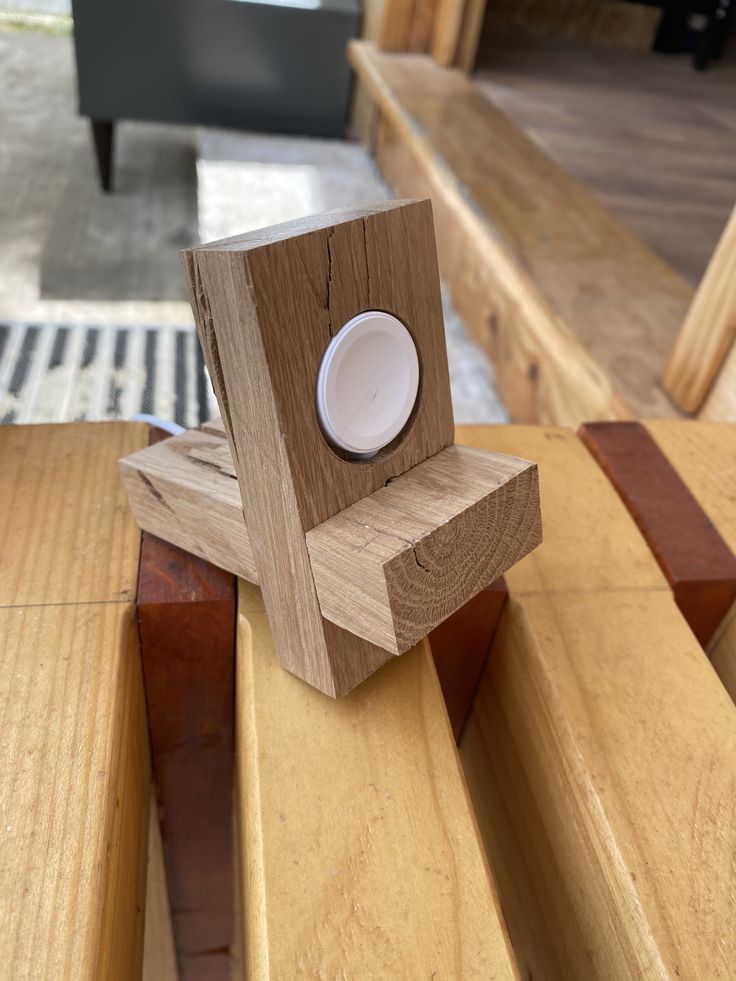 a wooden object sitting on top of some stairs