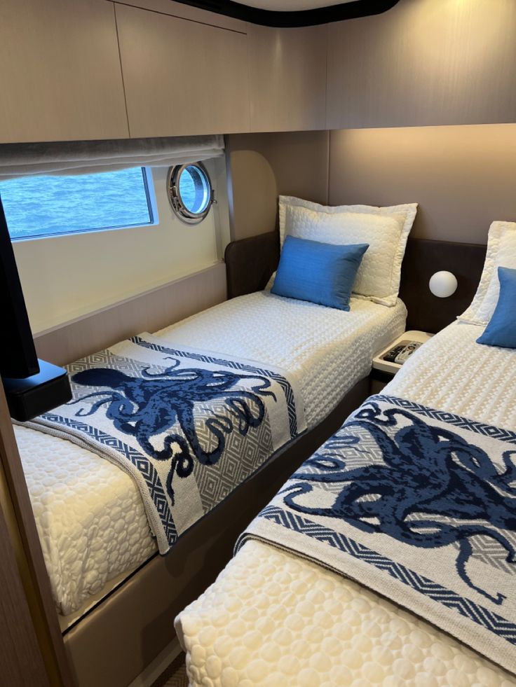 two beds in a small room on a boat