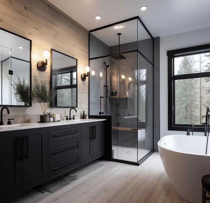 a bathroom with a large tub and two sinks