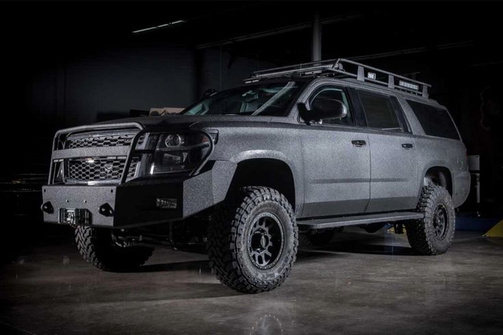 a silver truck is parked in a garage