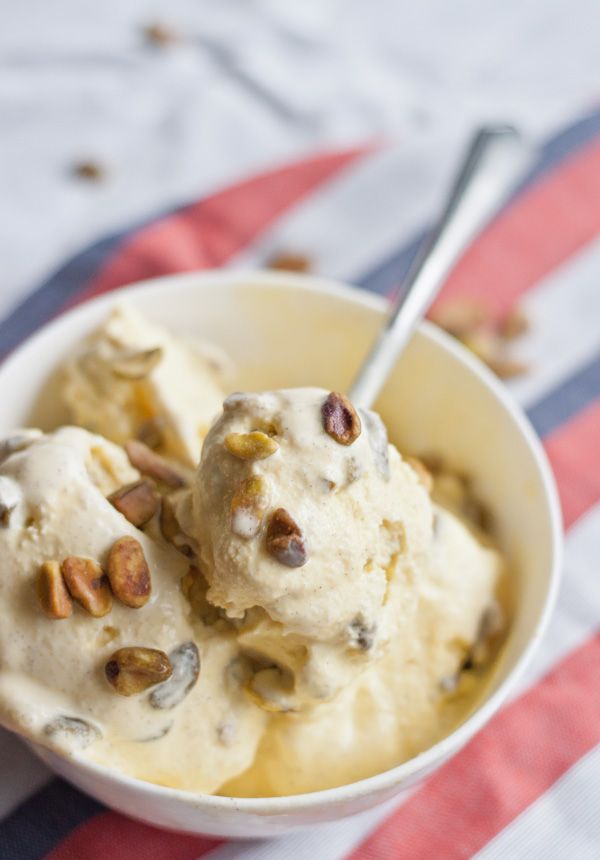 a bowl filled with ice cream and nuts