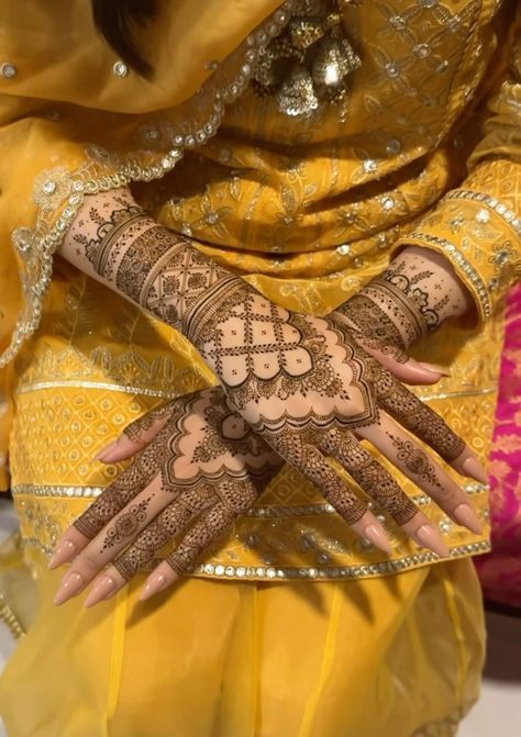 a woman's hands with hennap on it