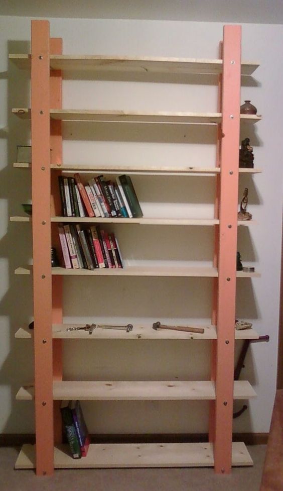 an orange shelf filled with lots of books