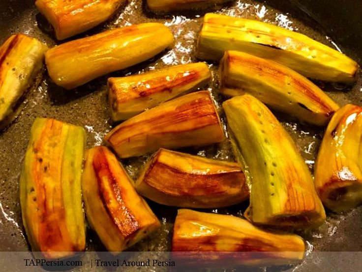 sliced up zucchini being cooked in a pan