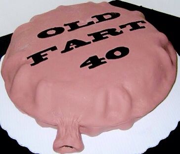 a cake with the words old far 40 on it is sitting on a black table