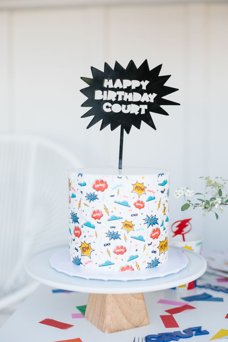 a birthday cake on a table with decorations