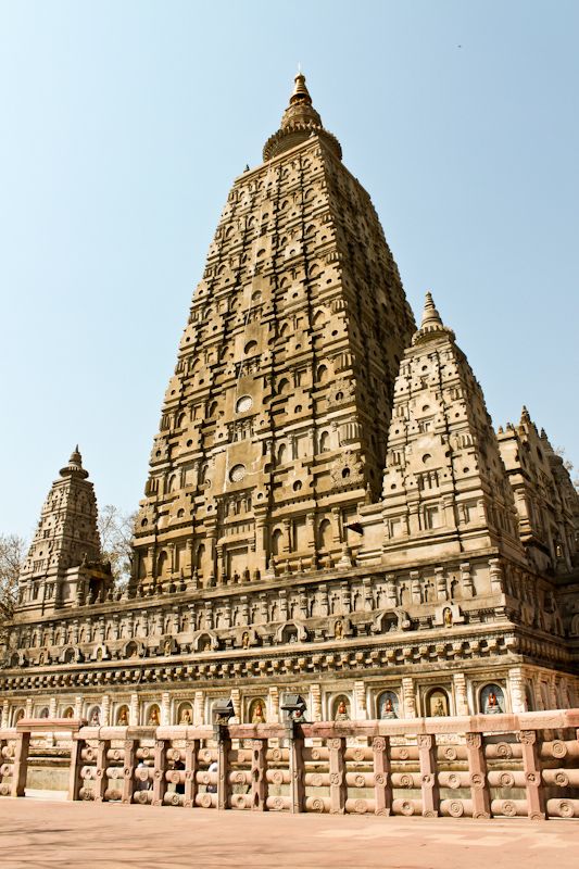 an ornate stone structure in the middle of a park