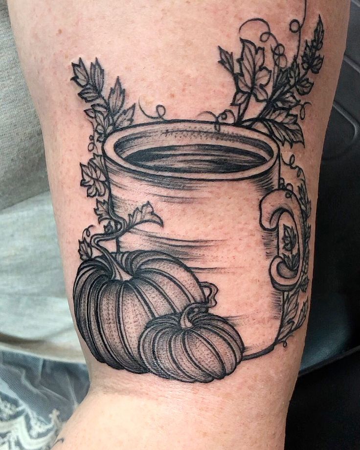 a black and white image of a jar with pumpkins on it