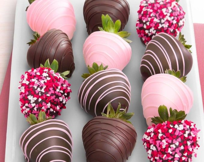 chocolate covered strawberries are arranged on a plate