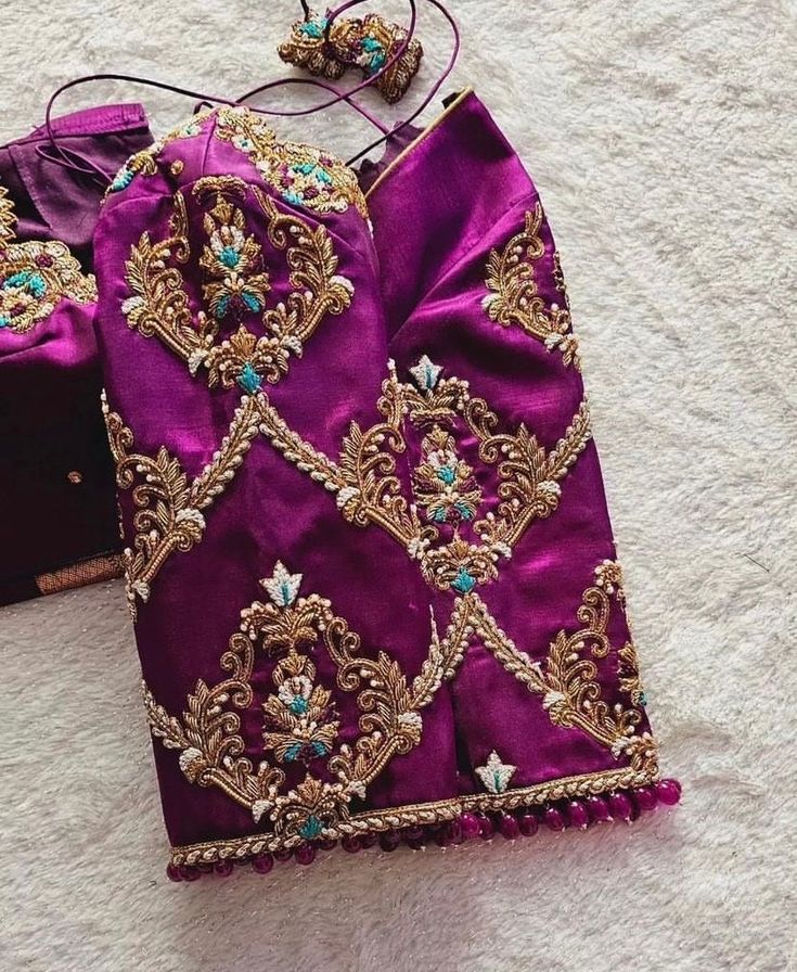 Hand embroidered ready made pure raw silk saree blouse / crop top/pink bridal stitched saree blouse usa /purple hand saree blouse/ hand embroidered blouse/zardosi blouse/puple heavy bridal saree blouse/ pure silk blouse/ magenta pink wedding heavy maggam work blouse        It is very true that a perfect blouse is the one which makes your saree look stand out !! If you find one of such a style that you have been wanting to have then dont let it go !! we carry such unique trending blouses that instantly add a stylish look to any saree !!     Well..!! we understand that you may not get in your desired size/pattern, here you go with customization according to your size/pattern which we can deliver in 1-2 weeks of time period !!      Here is a beautiful pure raw silk heavy Hand embroidered sare Bridal Work Blouse Designs, Blouse Work Designs Pattu, Zardosi Blouse, Hand Embroidery Blouse, Ready Made Blouse, Handwork Blouse, Maggam Blouse, Hand Embroidered Blouse, Latest Bridal Blouse Designs