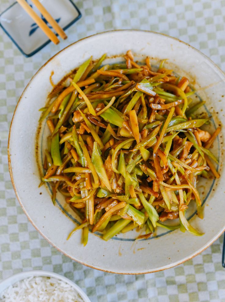 a white bowl filled with food on top of a table