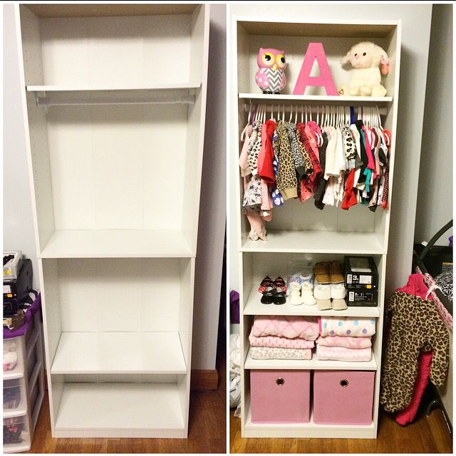 two white shelves filled with baby clothes and toys