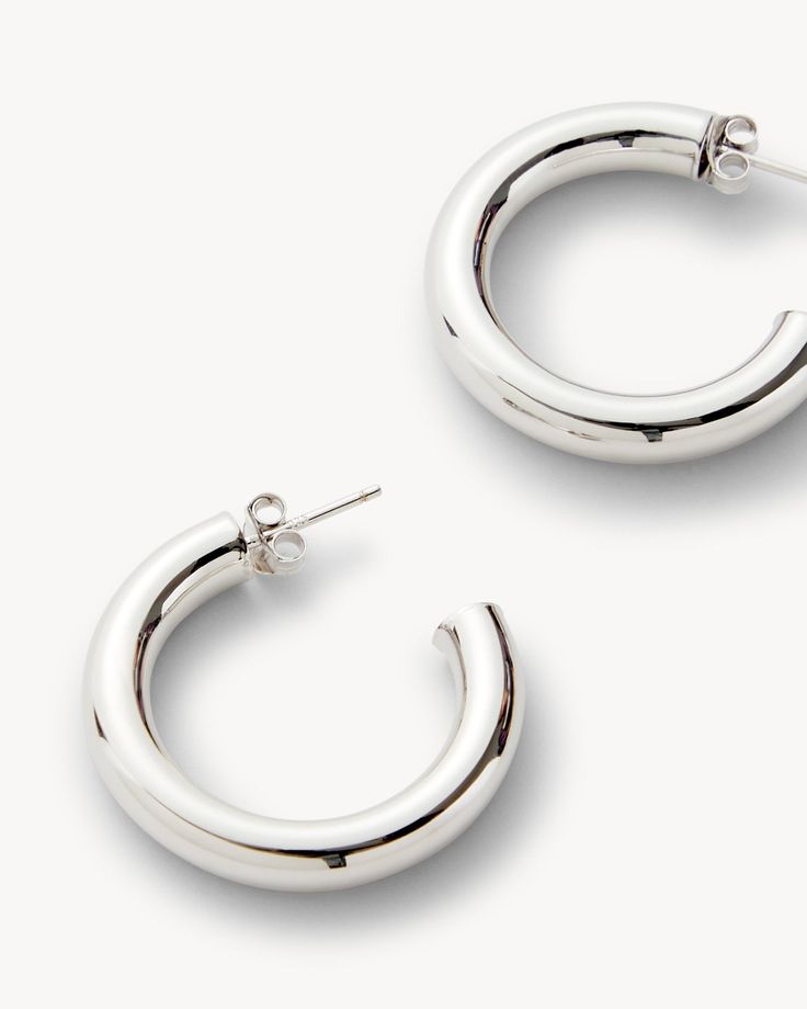 Truly perfect 1” hoops. Handmade from rhodium plated recycled brass with engraved butterfly backings. Everyday Small Silver Hoop Earrings, Polished Metal Hoop Huggie Earrings, Nickel-free Small Hoop Earrings In White Gold, Metal Hoop Earrings With Shiny Finish, Small Hoop Metal Jewelry With Shiny Finish, Shiny Metal Hoop Jewelry, Tarnish Resistant Sterling Silver Hoop Earrings, Polished Metal Round Hoop Earrings, Small Hoop Silver Earrings Tarnish Resistant