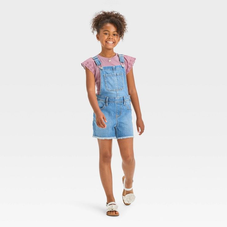 Update your casual outfits with these Cut-Off Jean Shortalls from Cat & Jack™. Made from stretchy denim fabric for flexible movement, the sleeveless shortalls feature a medium wash finish and a frayed hemline for a cool touch of laid-back style. The multiple utility pockets provide ample space to stash small items, while the adjustable shoulder straps with buckles offer a custom fit and the side snap buttons allow for easy on and off. They can match with their favorite tees for a quick and easy