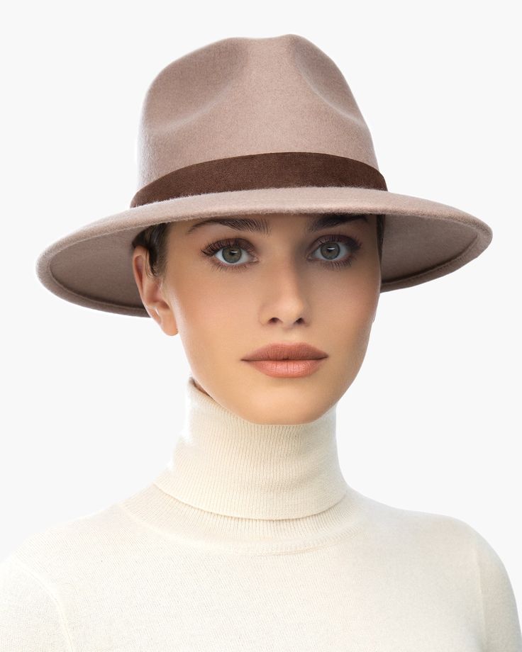 The versatile hand-blocked wool felt fedora banded with lamb leather is water-repellent. The Crown is fully lined. The elasticized inner band fits most. Packable. Made in the USA of imported materials. Sustainable wool is shorn and milled from multi-use sheep living on small farms under the most humane conditions. Designed and finished in USA Hand-blocked by skilled artisans Highest Quality Materials Sustainable wool Brim Span: 3"(7.6cm) Borsalino Hats, Small Leather Accessories, Small Farms, Gold Sand, Band Fits, Wool Fedora, Felt Fedora, Women's Headwear, Navy Linen