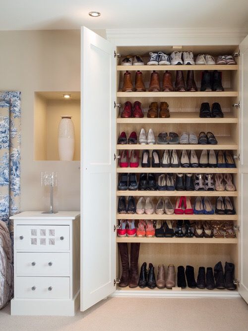 the closet is full of shoes and other items