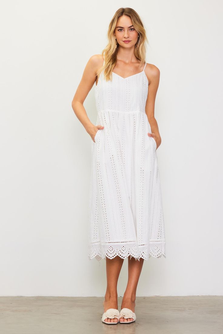 Our dreamy eyelet lace dress has a swoon-worthy silhouette with a sweetheart neckline, nipped-in waist, and scalloped hem. The smocked back and adjustable crisscross straps make for a figure-hugging fit up top. Pack it for your next sun-soaked getaway. •Adjustable straps •Smocked back •Hidden side zipper •Mid-length hem Item Number: 99695 Vacation Dresses Casual, Wedding Guest Dress Trends, Eyelet Lace Dress, Casual Wedding Dress, Lace Midi, Vacation Dresses, Eyelet Lace, Lace Midi Dress, Sweater Sale