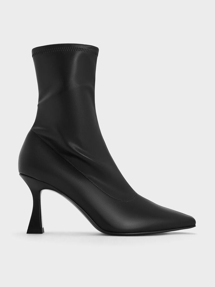 If you hope to look sharp this fall winter season, then these ankle boots are the perfect choice. Featuring elongated, tapered square toes in inky black, the sleek silhouette of these boots will streamline your frame. The boot shafts sit closer to the legs for a leg-lengthening effect, and also feature side-zip closures for ease of wear. Propped up on sturdy trapeze heels, they will help balance out bulky layers by giving your frame a flattering lift. Square Toe Ankle Boots, Tapered Square, Charles Keith, Black Ankle Boots, Winter Season, Side Zip, Ankle Boots, Fall Winter, Sleek