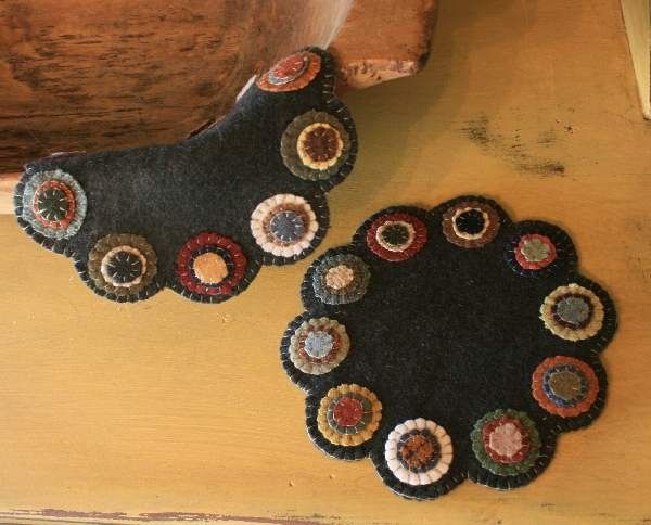 two black rugs sitting on top of a wooden table