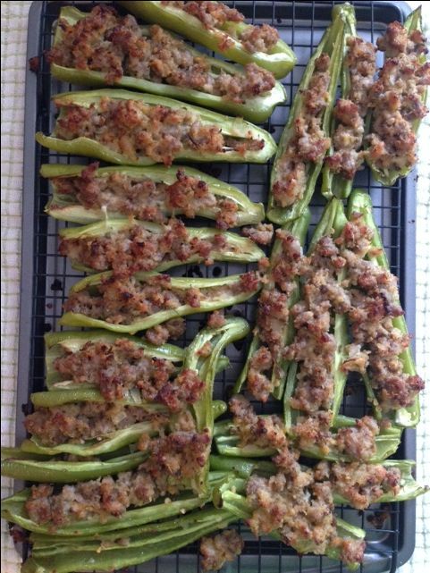 green beans with meat on them sitting on a cooling rack