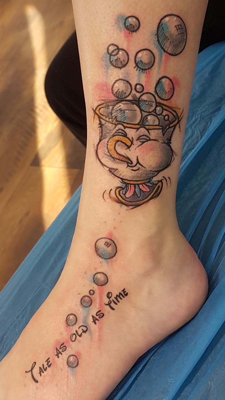 a person with a tattoo on their foot