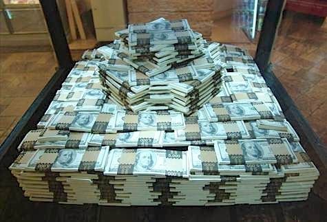 stacks of money sitting in front of a mirror