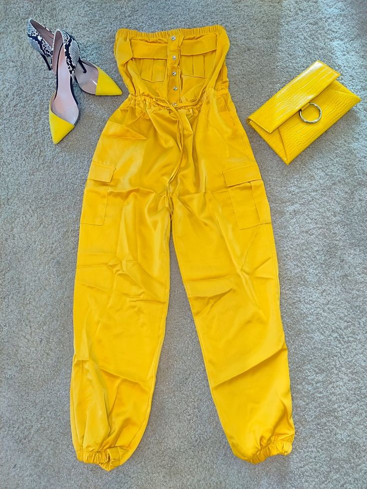 Yellow jumpsuit perfect for the Summer 🌤️! Make this a year round outfit by pairing with a blazer and ankle boots during the Fall 🍁. Trendy Strapless Jumpsuit With Pockets, Trendy Fitted Strapless Jumpsuit With Pockets, Casual Fitted Overalls, Casual Fitted Overall Pants, Spring Overalls For Night Out, Casual Yellow Jumpsuits And Rompers For Work, Solid Color Overall Jumpsuits And Rompers For Fall, Spring Stretch Overalls, Casual Strapless Fitted Jumpsuit