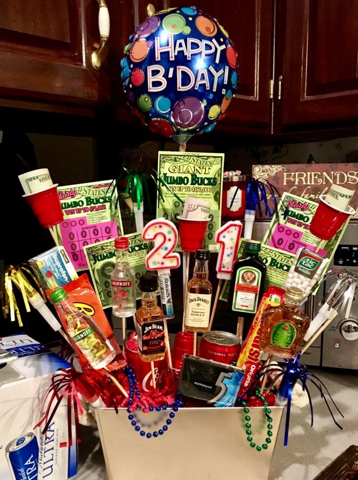 a birthday gift basket filled with candy, candies, and other items for someone's 21st birthday