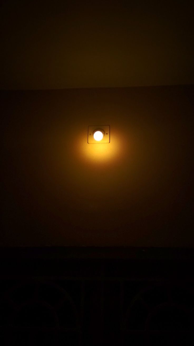 a light that is on in the dark with no one around it or someone else