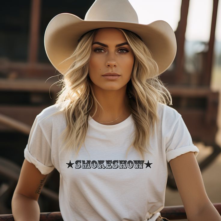 Smokeshow Graphic t-shirt for country girls and cowgirls is a Bella Canvas brand tee and comes in unisex cut and sizes. This graphic tee proudly proclaims you're a smokeshow and proud of it. Looks perfect alone or layered under a chic black blazer for a more sophisticated look. Whether she's an Oklahoma Smokeshow like the popular country song, or any smalltown smokeshow, she's worth celebrating. The perfect shirt for the rodeo, country music concert, a bachelorette party in Nashville or around t Bachelorette Party In Nashville, Country Photoshoot, Country Music Concert, Farm Fashion, Nashville Bachelorette Party, Country Music Concerts, Country Song, Nashville Bachelorette, Western Outfits Women