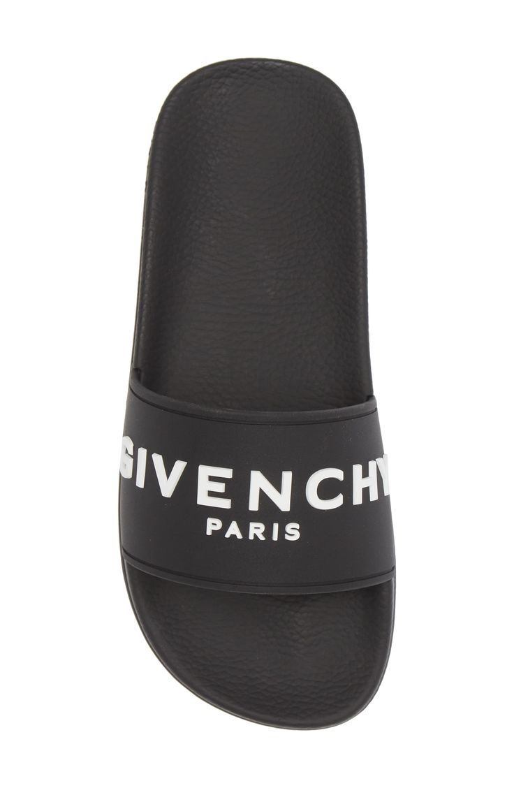 A bold Givenchy logo stamp crosses the wide strap of cushy, water-friendly sliders. Synthetic upper, lining and sole Made in Italy Women's Designer Shoes Designer Black Sandals With Logo Strap, Black Sandals With Logo Strap For Summer, Designer Beach Slides With Cushioned Footbed, Logo Slip-on Sandals For Summer, Designer Slides With Branded Insole For Beach, Designer Beach Slides With Branded Insole, Designer Slides For Summer, Summer Slip-on Sandals With Logo, Summer Beach Slides With Logo