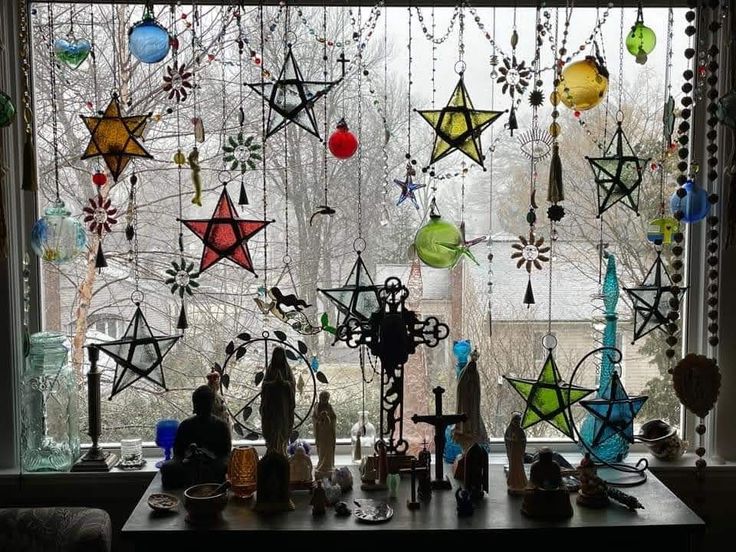 the window is decorated with many colorful ornaments