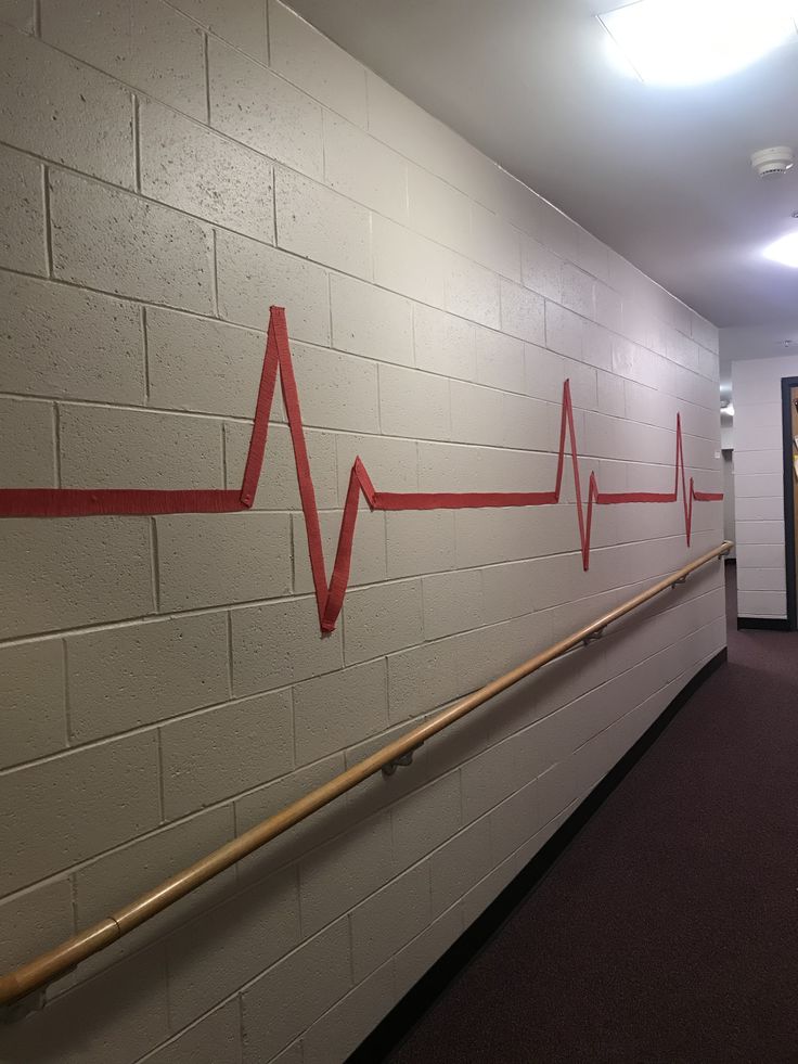 a white wall with a red line painted on it